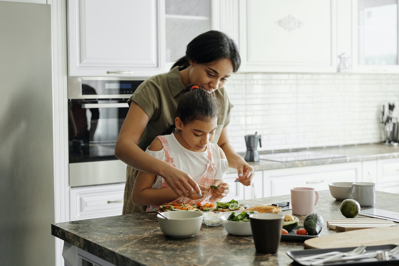 Mother and daughter preparing organic and healthy food